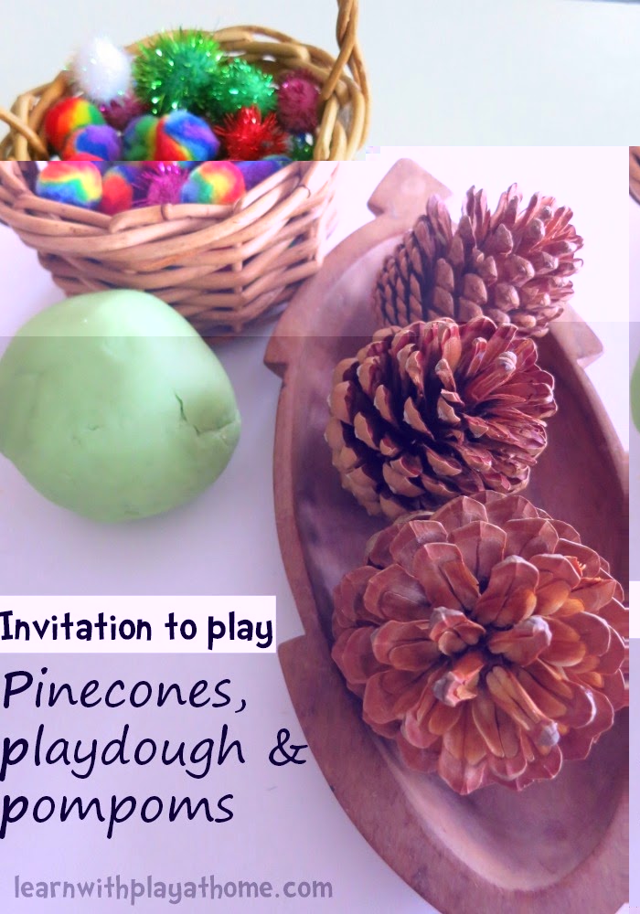 invitation to play pinecones, playdough and pompoms